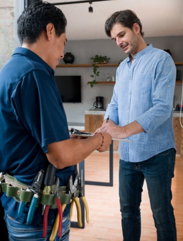 Man filling maintenance form with maintenance person